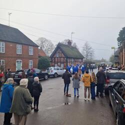 A few more people gathered to see the Morris Dancers