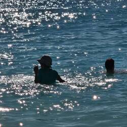 DJ (in the hat) in the water. He was in the water the whole time we were there