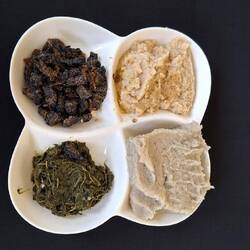 Tree caterpillars top left, then clockwise, mashed black eye peas, maize porridge and spinach.