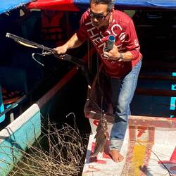 Boat driver speared a fish