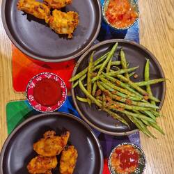 Homemade pakoras and gujarati beans with dipping bowls Sarah gave us for Christmas
