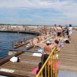 Sunbathers on pier