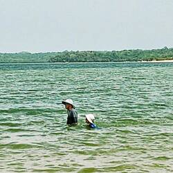 Jeff and DJ wading in the Amazon
