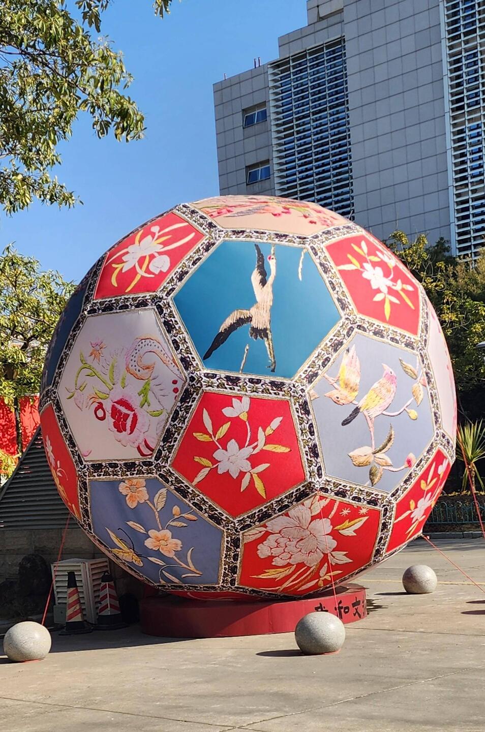 Massive embroidered ball often associated with good fortune and love