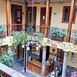 The hotel's internal courtyard, though now with a glass roof to keep the rain out.
