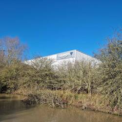 Will got excited when he spied the Triumph motorbike factory from the canal