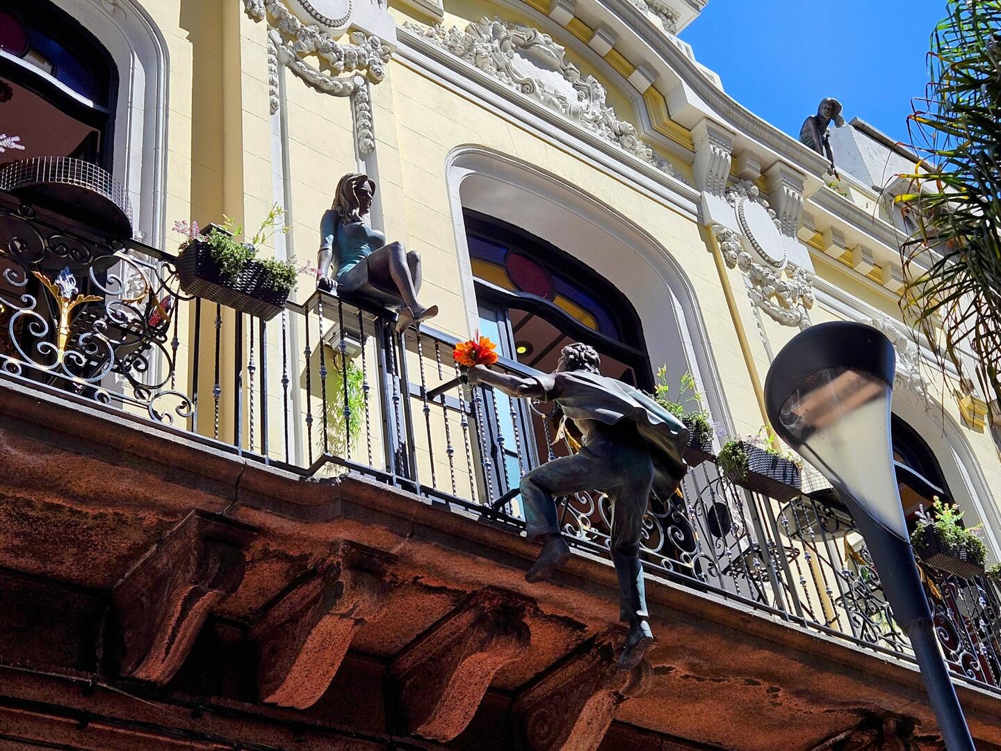 Romeo climbing up to see Juliet? And who's that up above?