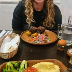 Eating a large trout with Paige, who we met up Machu Picchu