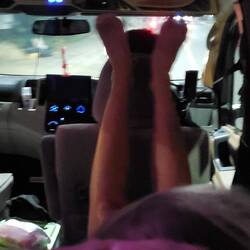 One of our group resting her feet on the driver's headrest on the ride home! 🤪