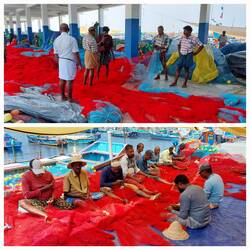 Fishermen repairing nets