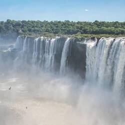 Iguazu Falls Argentina side with swallows which nest behind the falls