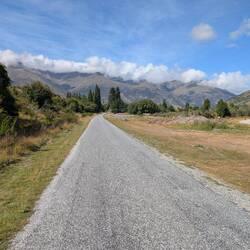On the cycle track with The Remarkables peaks in the distance