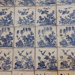 Hand painted Chinese tiles on the floor; all the rows are subtly different