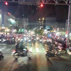 Evening avalanche of scooters, bikes and motorcycles