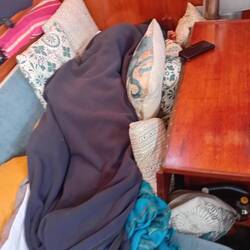 Our little sleeping cocoon made of every cushion and blanket that we have!!