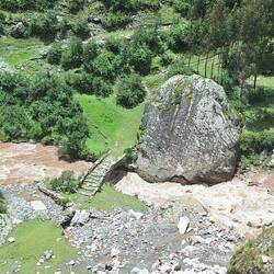 I'm assuming the giant boulder finished up in that position before they built the stone bridge.