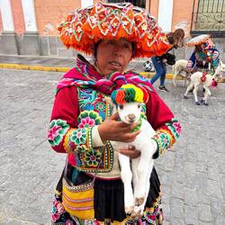 Many people come down from the Andes mountains to earn money by posing for photos