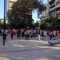 Students learning to do Latin dancing in the street
