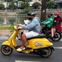 Baby and dad, and check out the woman riding sidesaddle