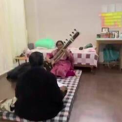 Vijay's mother playing the Sitar