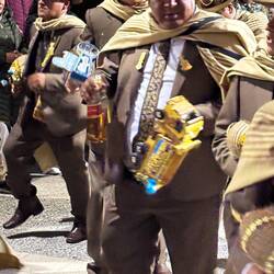 A bottle of Johnny Walker Red. Dancing with a alcoholic beverage was common.