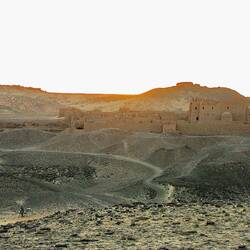 Our camel train passes the Monastery of St Hedra at Sunset