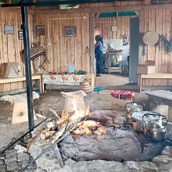 The cooking fire takes centre place; other food prep is done in the kitchen behind