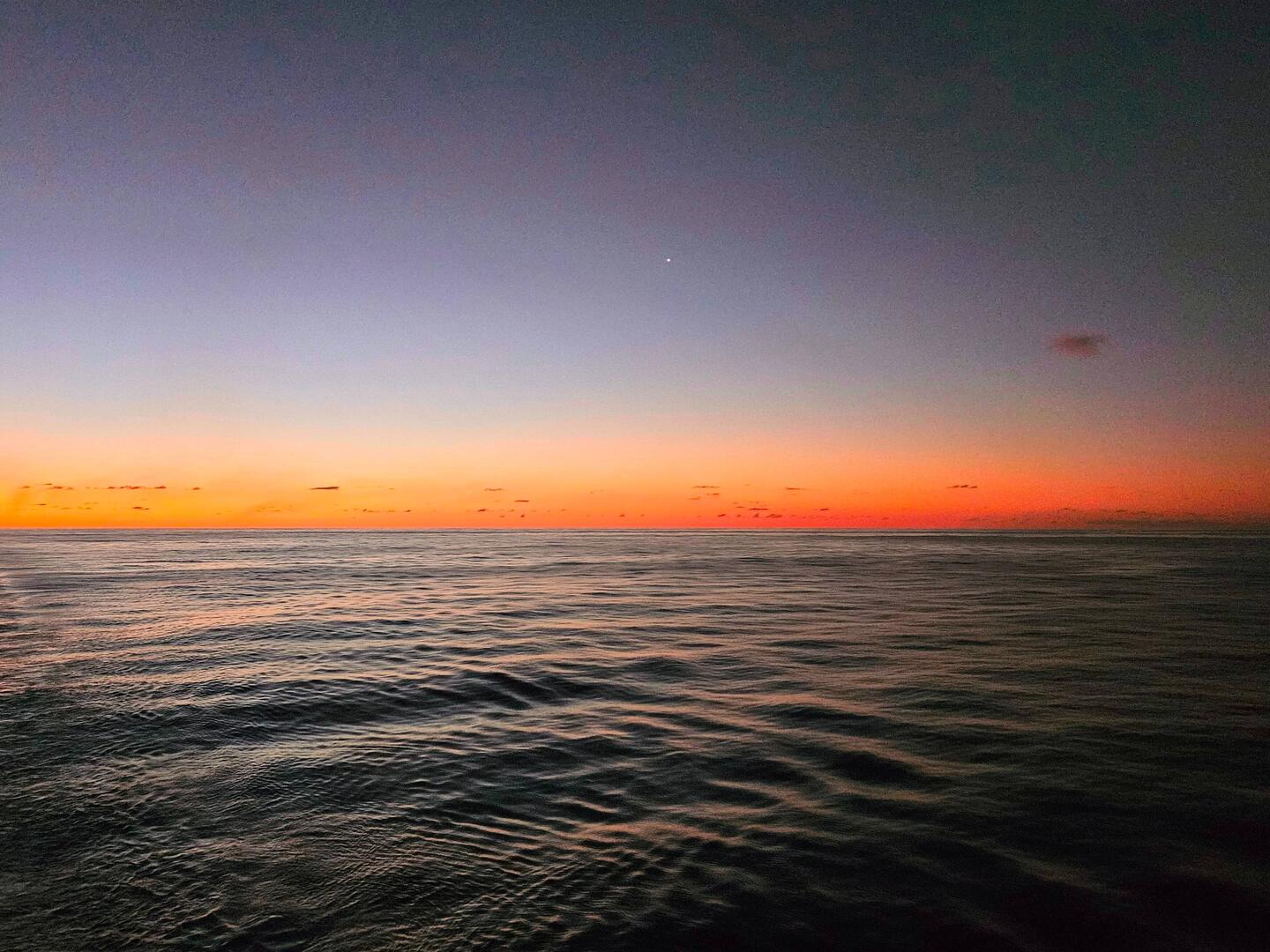 Sunset with Venus over calm seas