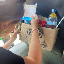Anna making marketing for a women's street vendor