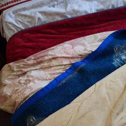 A sheet, two blankets, a quilt and a top cover, warm, but felt like someone was laying on top of me.