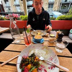 Chris always eyeing my food for leftovers. This was our brunch in Queenstown before hitting the road