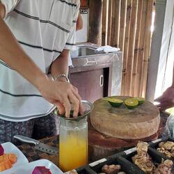 Making us fresh squeezed tangerine juice!