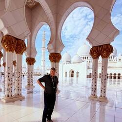 Paul standing in front of a stunning view