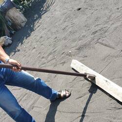 The rake to move the dried salt off the black sand