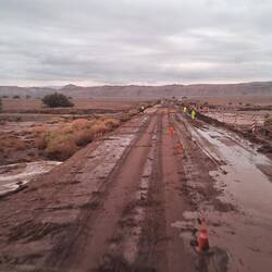 Rain over the last few days must have swollen the river and dragged sand and debris across the road.