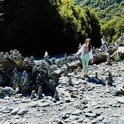 So many rock stacks on this fallen tree!