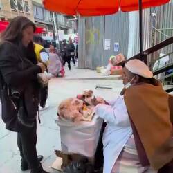 Carving meat off a ham making sandwiches