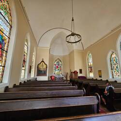 Interior of the Felsenkirche. The simplicity helps the windows stand out.