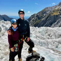 Standing on Franz Josef Glacier with the Pacific Ocean in the background