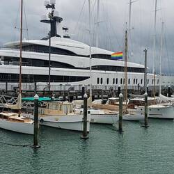 A number of historic boats are lined up; significantly smaller than the IJE.
