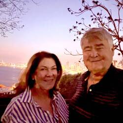 Paul and Robin in front of the beach overlook at dusk