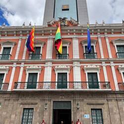 The original president's palace in the foreground and the modern building behind it replaced it