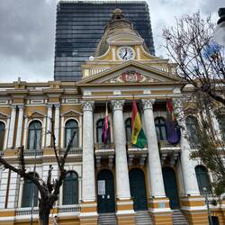 The original legislature and the new building behind it replaced it
