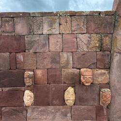 The sculptures of human faces are all around the underground temple