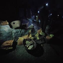 Local miners carry 75-90kg of solid sulphur out of the crater twice a day 😦