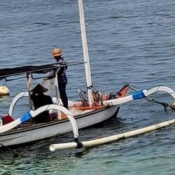 These two guys were heading out with a fishing rod.