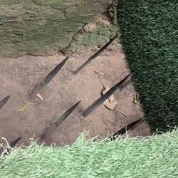 A trap door with bamboo spikes to land on