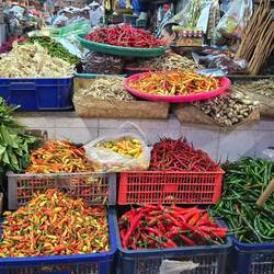 Numerous different chili peppers at the outside market.