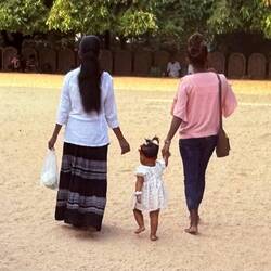 Sweet little girl learning about Buddism