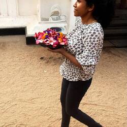 Young lady with flowers for the temple